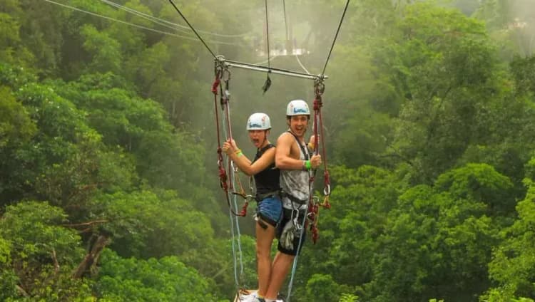 Two people on zipline